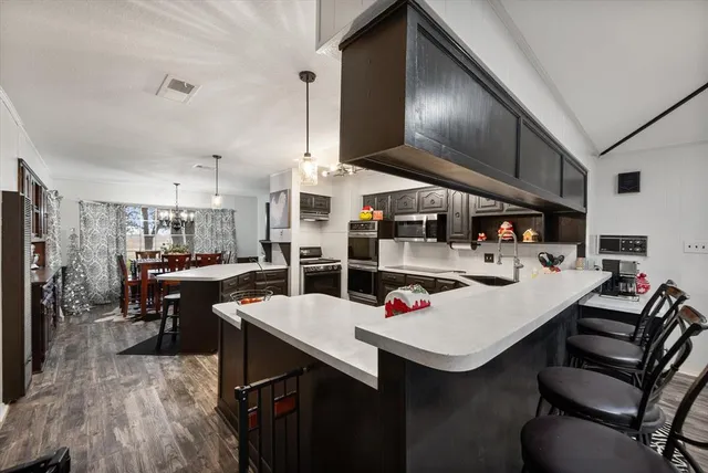 a view of a dining room with furniture and wooden floor