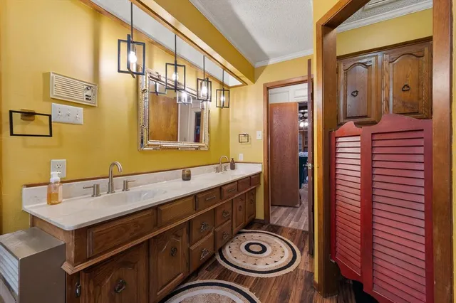 a bathroom with a sink and a washer dryer