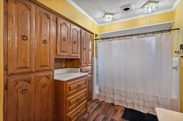 a bathroom with a sink a mirror and a shower