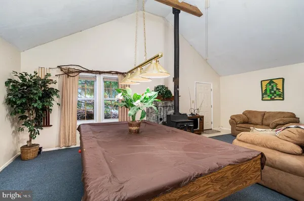 a bedroom with furniture and a potted plant