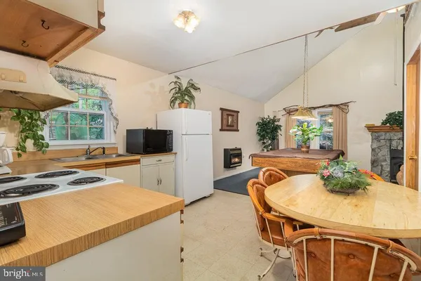 a dining room with furniture and window