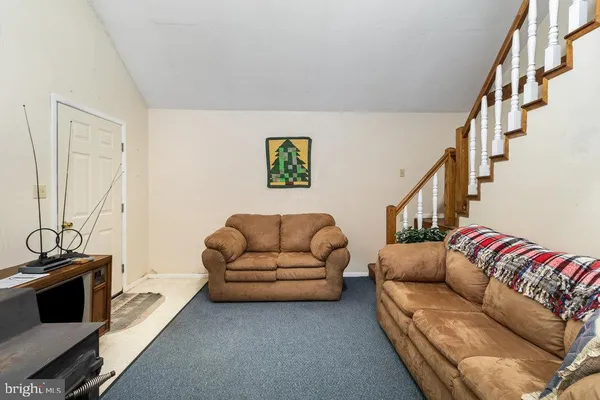 a living room with furniture and a couch