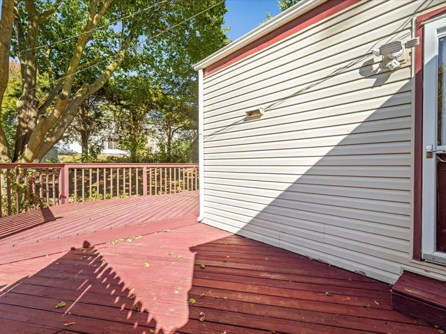 a view of a yard with a house and large trees