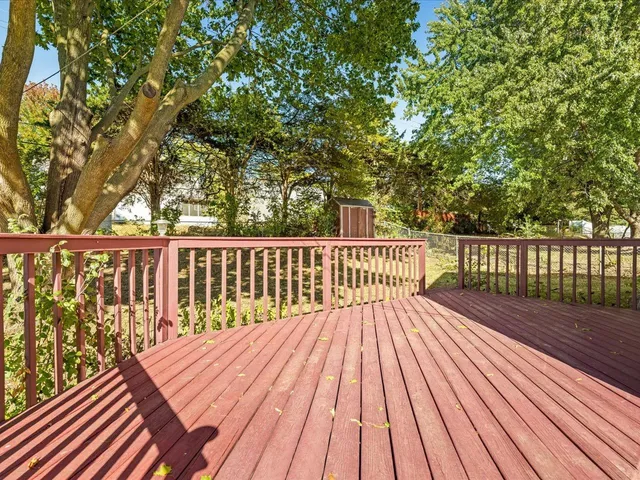 a view of a house with a yard and a garden