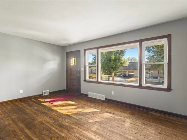 a view of an empty room with a window
