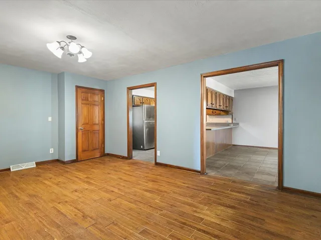 a view of a kitchen with a sink and a stove top oven