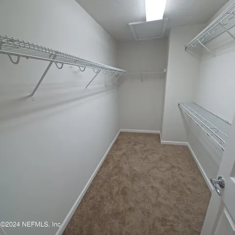 a view of a room with racks on the wall