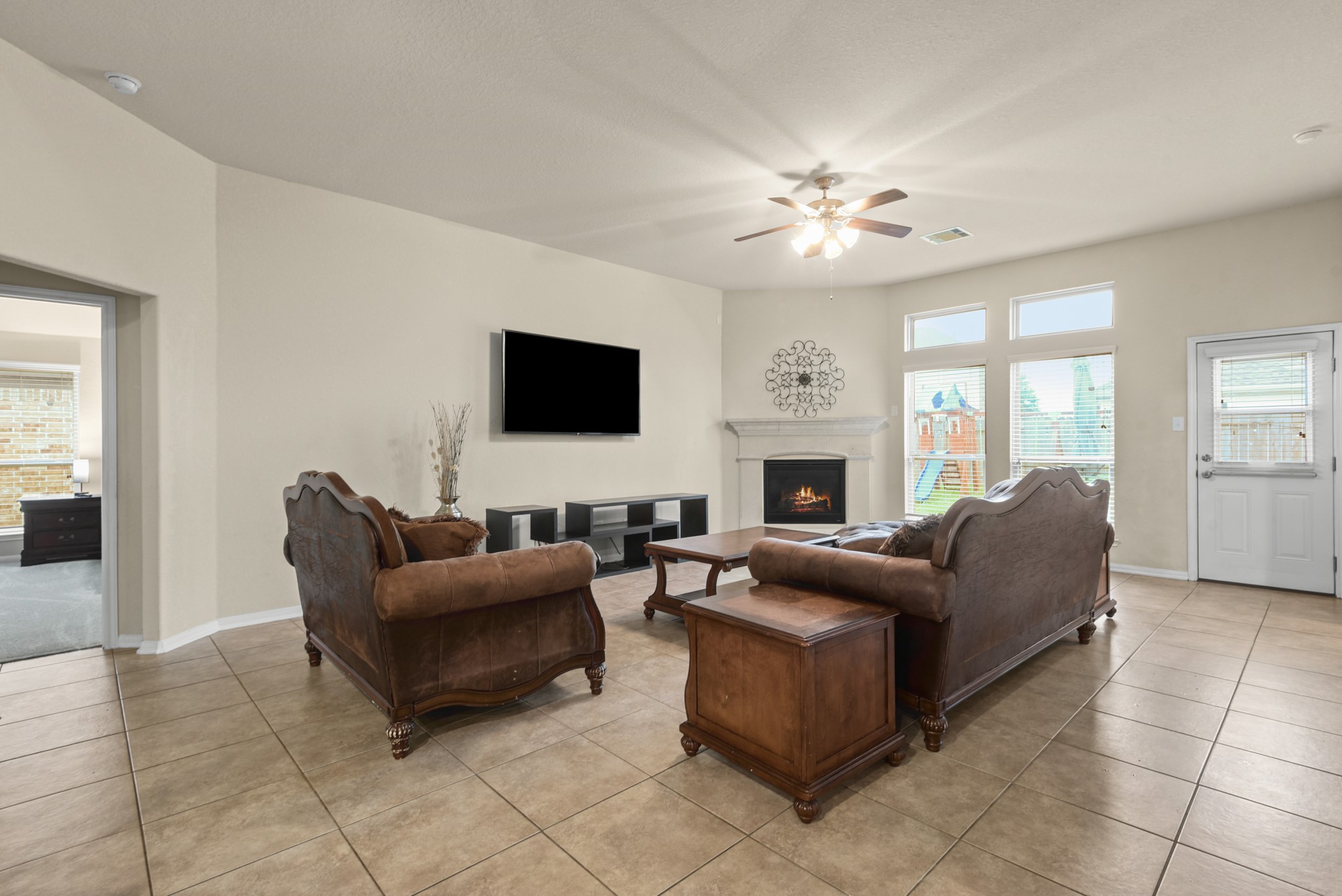5211 Cayenne Lane Baytown, TX 77521 - Photo 4 of 19 The living room has ample natural light, with the fireplace being a focal point of the room.