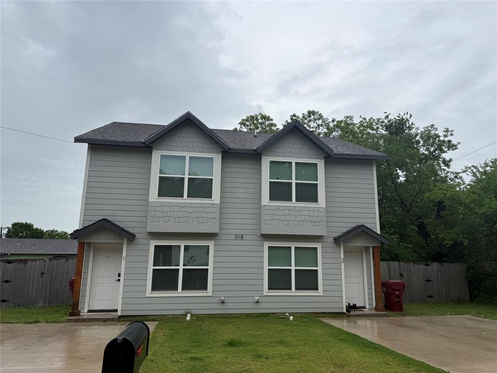 318 Henderson Street Bonham, TX 75418 - Photo 12 of 12 a front view of a house with a garden