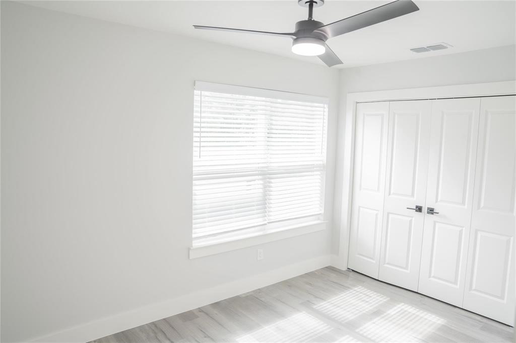 318 Henderson Street Bonham, TX 75418 - Photo 4 of 12 a view of an empty room with a window