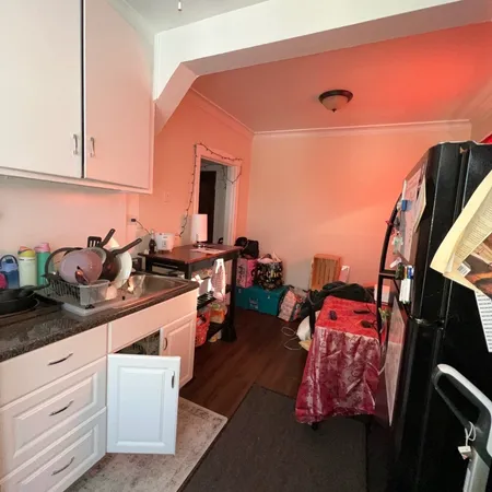 a kitchen with stainless steel appliances a sink and cabinets