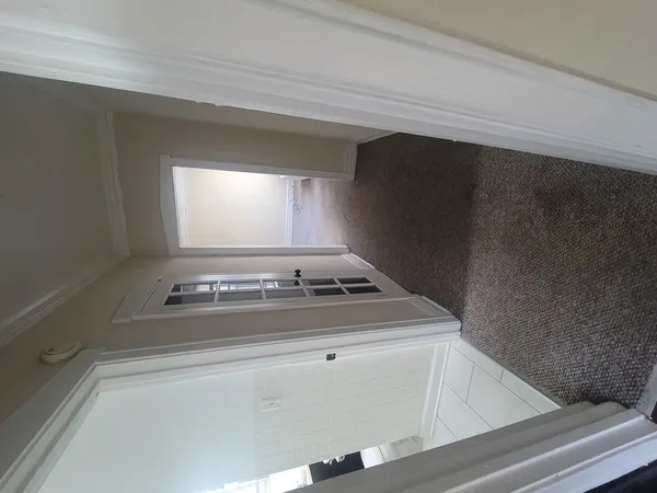 a stove top oven sitting inside of a kitchen