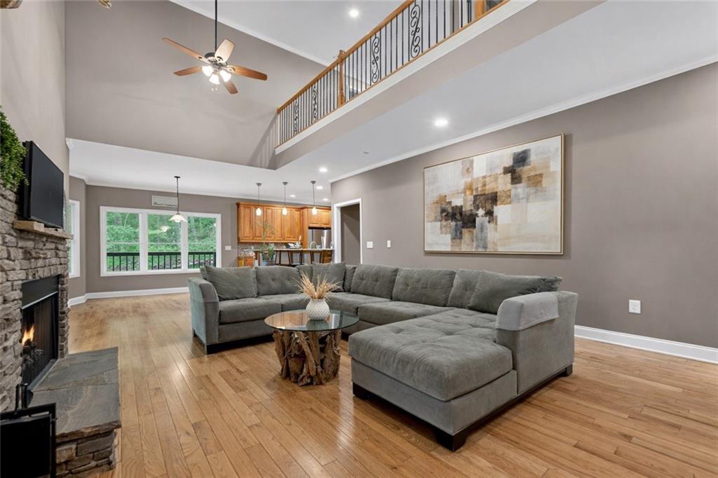 3184 St. Andrews Way Ellijay, GA 30536 - Photo 16 of 51 a living room with furniture and a large window