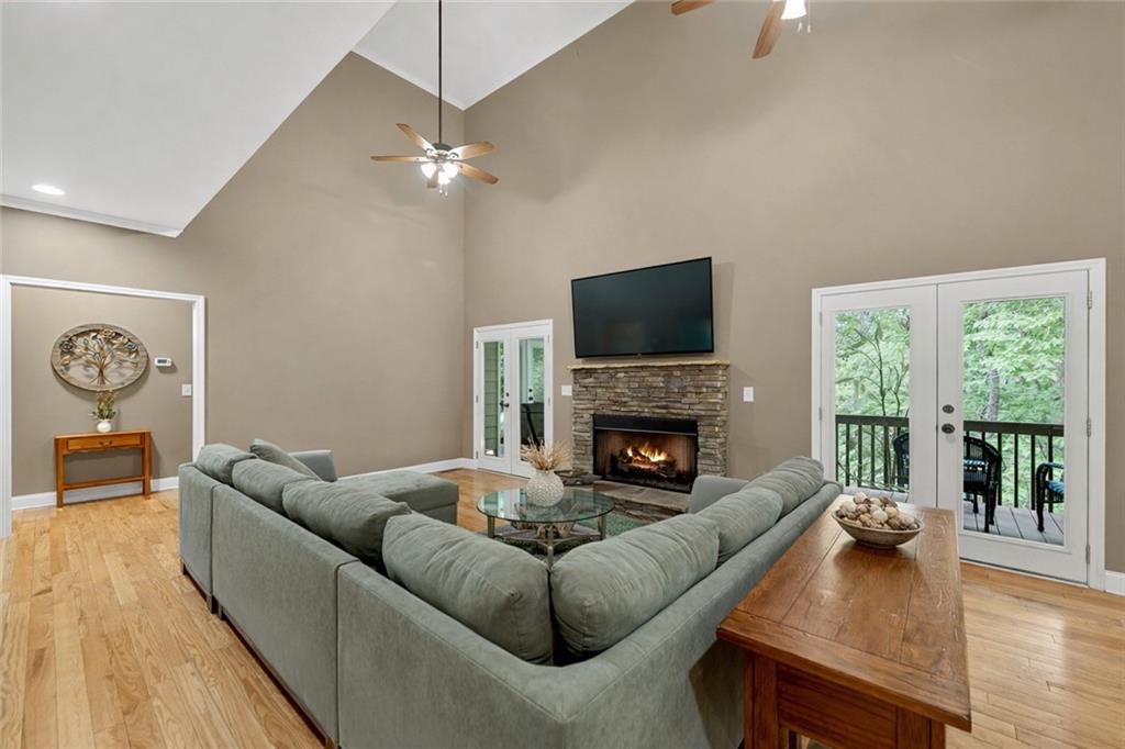 3184 St. Andrews Way Ellijay, GA 30536 - Photo 17 of 51 a living room with furniture and a fireplace