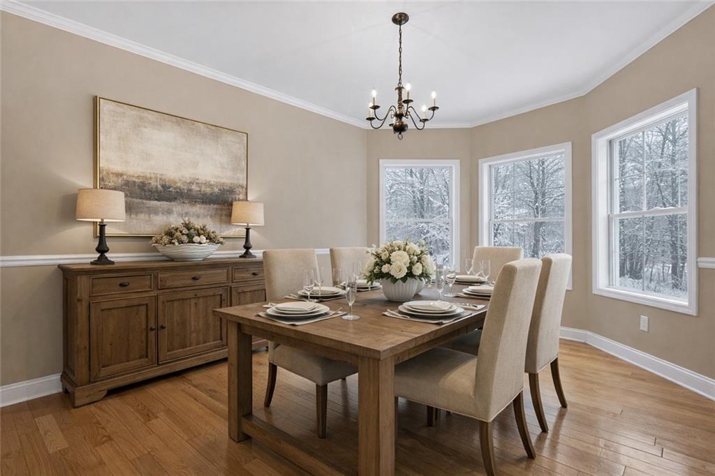 3184 St. Andrews Way Ellijay, GA 30536 - Photo 18 of 51 a view of a dining room with furniture window and wooden floor
