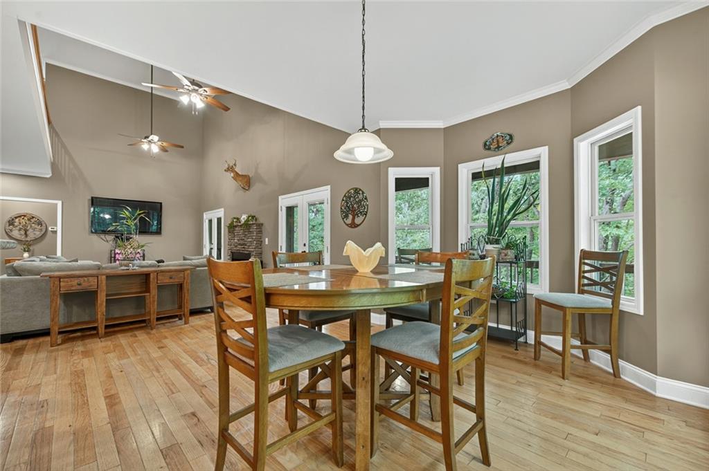 3184 St. Andrews Way Ellijay, GA 30536 - Photo 23 of 51 a view of a dining room with furniture window and wooden floor
