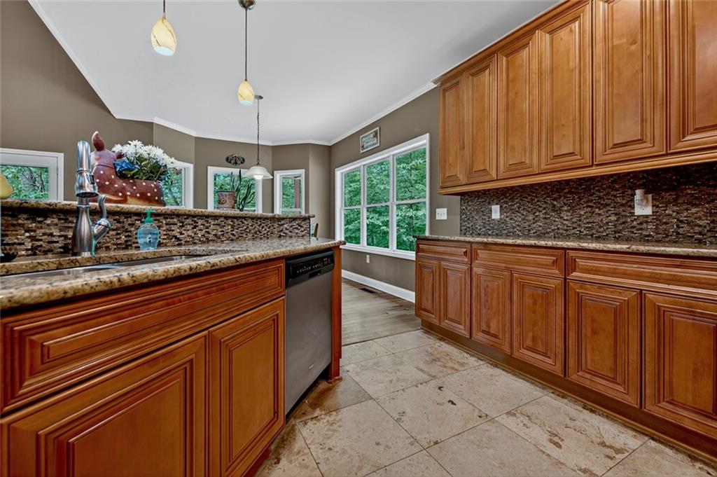 3184 St. Andrews Way Ellijay, GA 30536 - Photo 28 of 51 a kitchen with stainless steel appliances granite countertop a sink and cabinets
