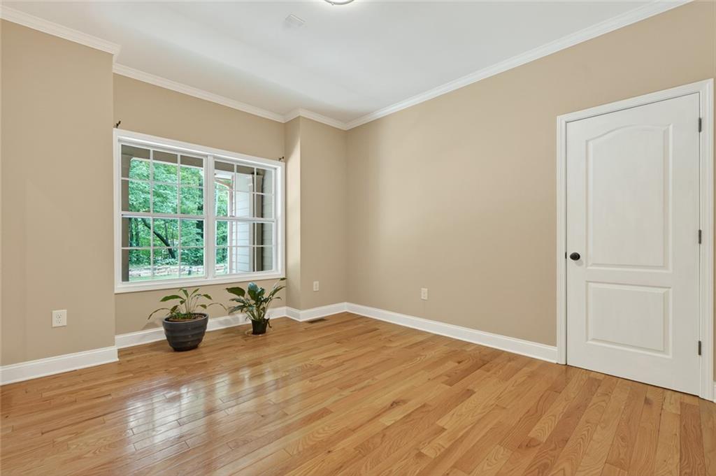 3184 St. Andrews Way Ellijay, GA 30536 - Photo 35 of 51 a view of empty room with wooden floor and window