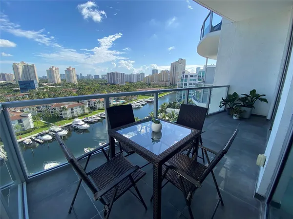 a view of a balcony with furniture
