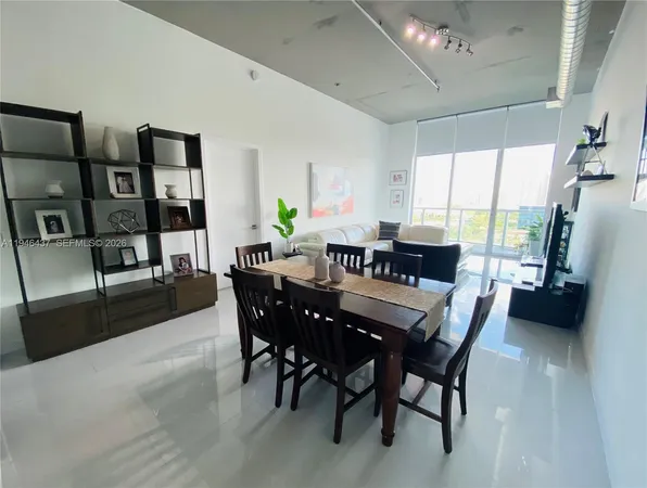 a view of a dining room with furniture window and outside view