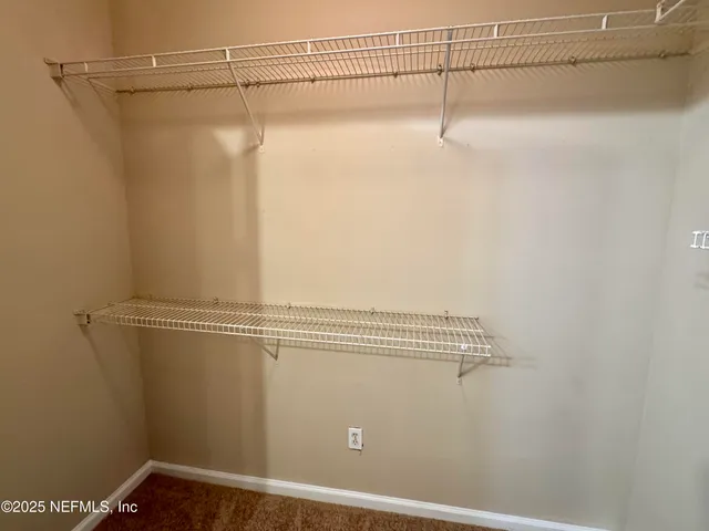 a view of a room with racks on the wall