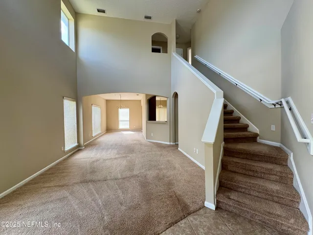 a view of a hallway with staircase