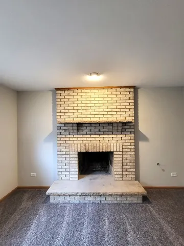 an empty room with a fireplace