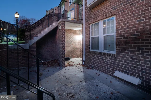 a view of a house with iron fence