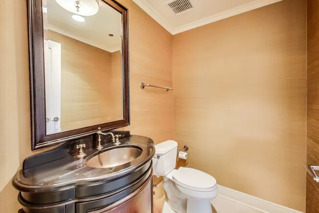 a bedroom with a bed a table and chair