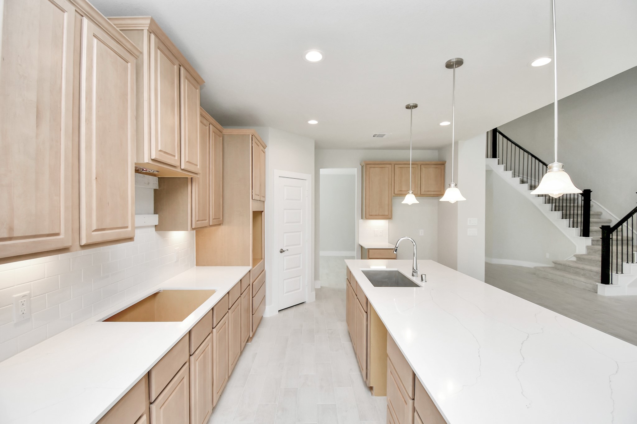 3038 Native Spg Drive Spring, TX 77373 - Photo 12 of 40 The extended counter area adds both practicality and style, making meal preparation a breeze. Every detail is thoughtfully designed to enhance the kitchen's functionality and aesthetic appeal. Sample photo of completed home with similar floor plan. Actual colors and selections may vary.