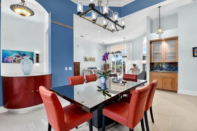 a dining room with furniture and window