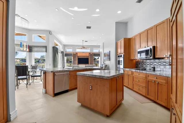 a living room with furniture ceiling fan and a rug
