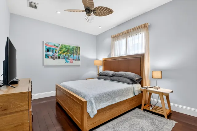 a view of a lake with houses in the background