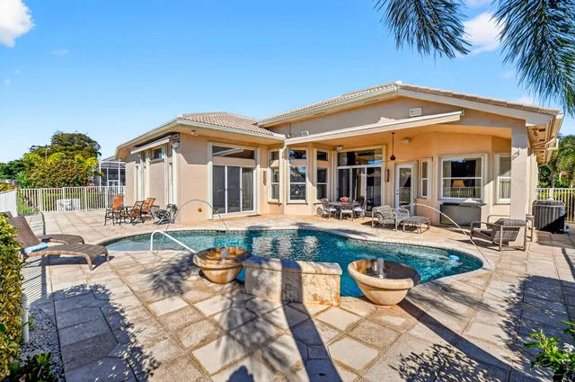 a view of a dining area with furniture and chandelier