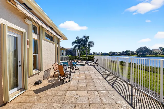 a room with pool table and a chandelier