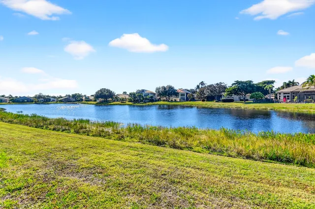 a view of a building with a umbrellas in front of building
