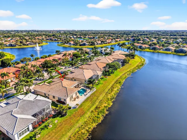 a view of a house with swimming pool and sitting area