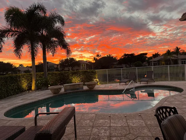 a living room with fireplace furniture and a window