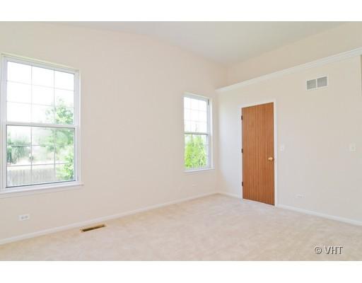 293 Shagbark Court Round Lake, IL 60073 - Photo 6 of 10 an empty room with windows