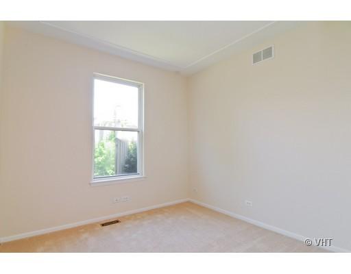 293 Shagbark Court Round Lake, IL 60073 - Photo 8 of 10 an empty room with a window