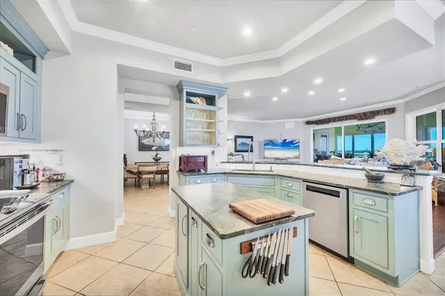 a kitchen with a stove a sink and a refrigerator