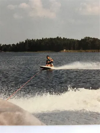 a view of a lake in middle of forest