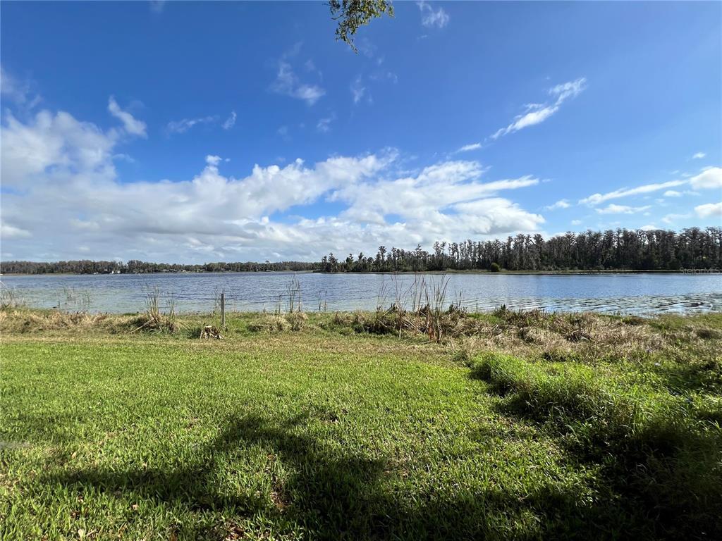 Debuel Road Lutz, FL 33549 - Photo 20 of 20 a view of a lake with houses in the back