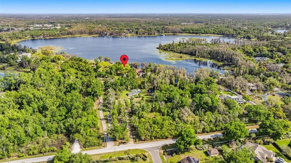 a view of a lake with houses in the back