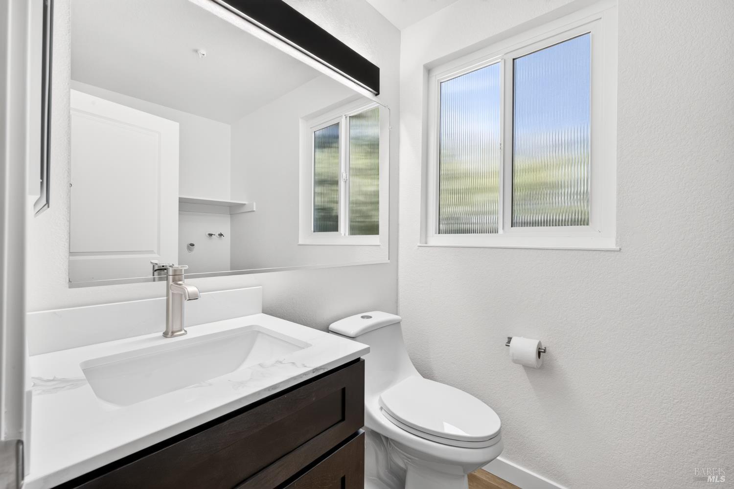 4601 Harbor Lane Rohnert Park, CA 94928 - Photo 23 of 38 Main Floor Half Bath (You can see the full-size laundry appliance Hook ups in the mirror.)