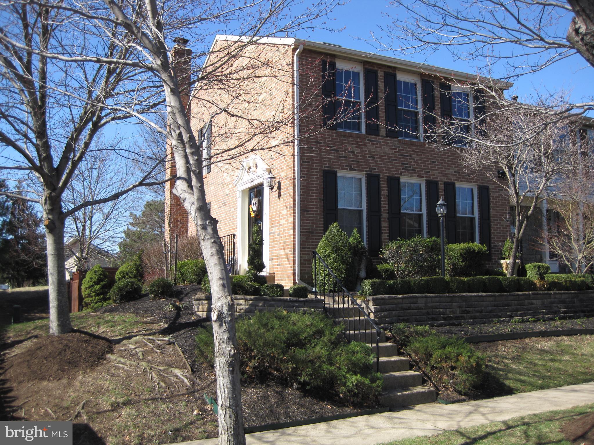 6178 Morning Glory Road Alexandria, VA 22310 - Photo 1 of 26 a front view of a house with yard and green space