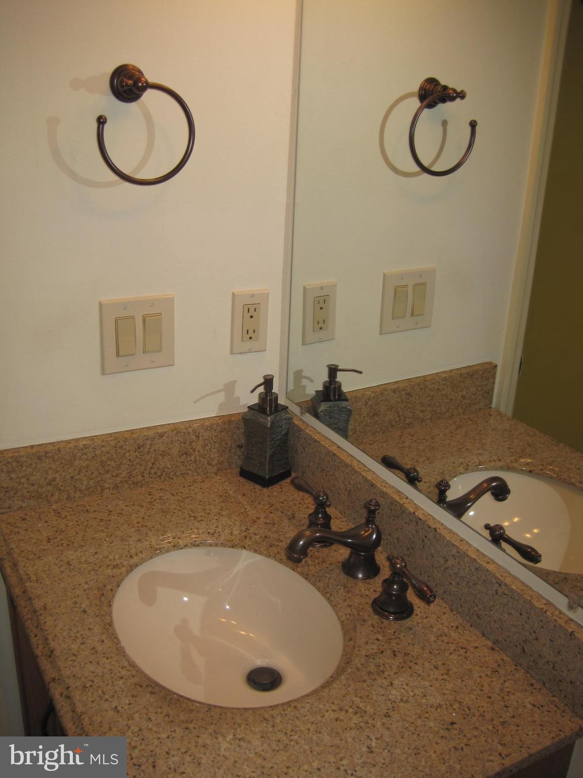 6178 Morning Glory Road Alexandria, VA 22310 - Photo 17 of 26 a bathroom with a sink and mirror