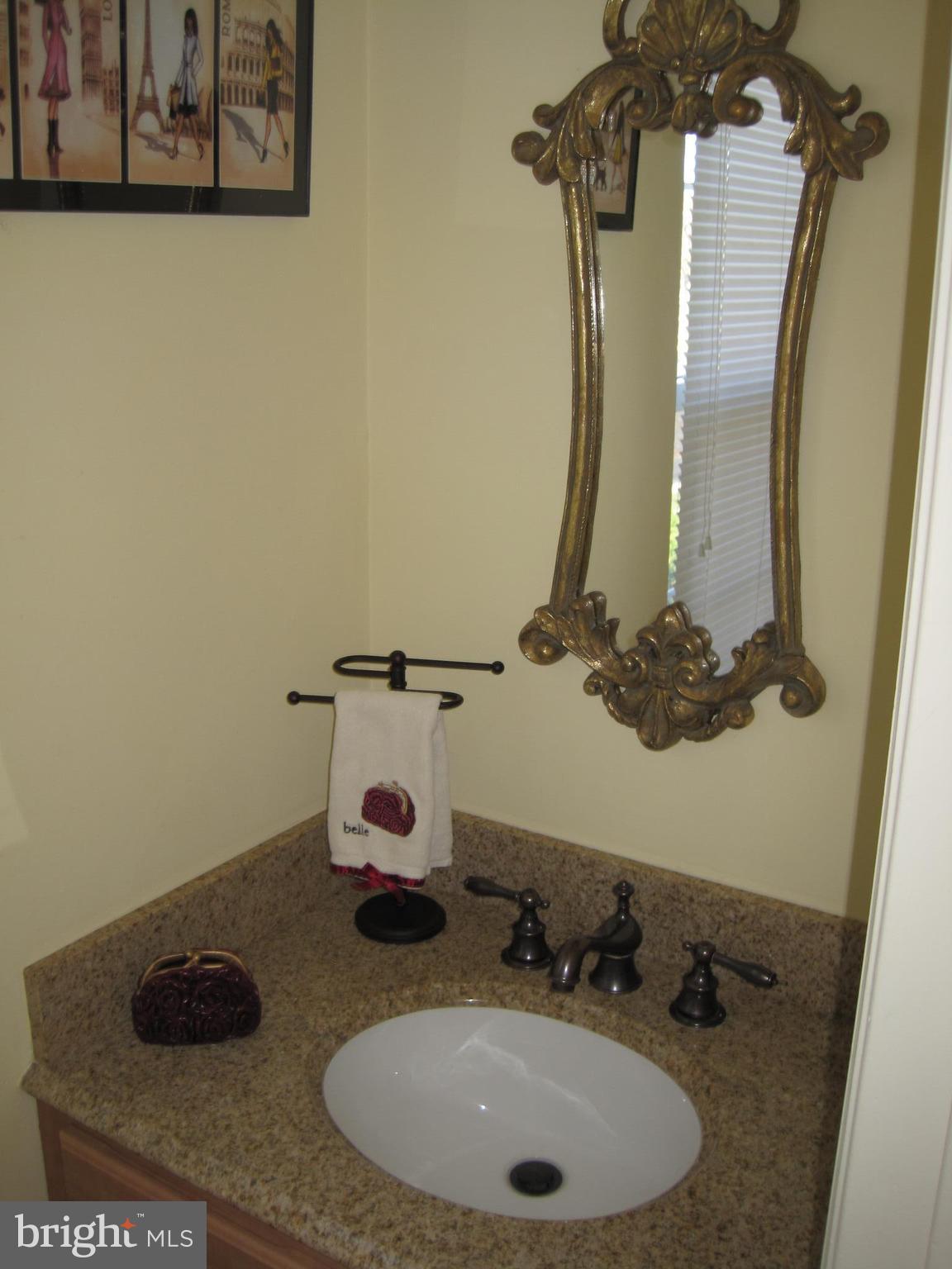 6178 Morning Glory Road Alexandria, VA 22310 - Photo 18 of 26 a bathroom with a sink and a mirror