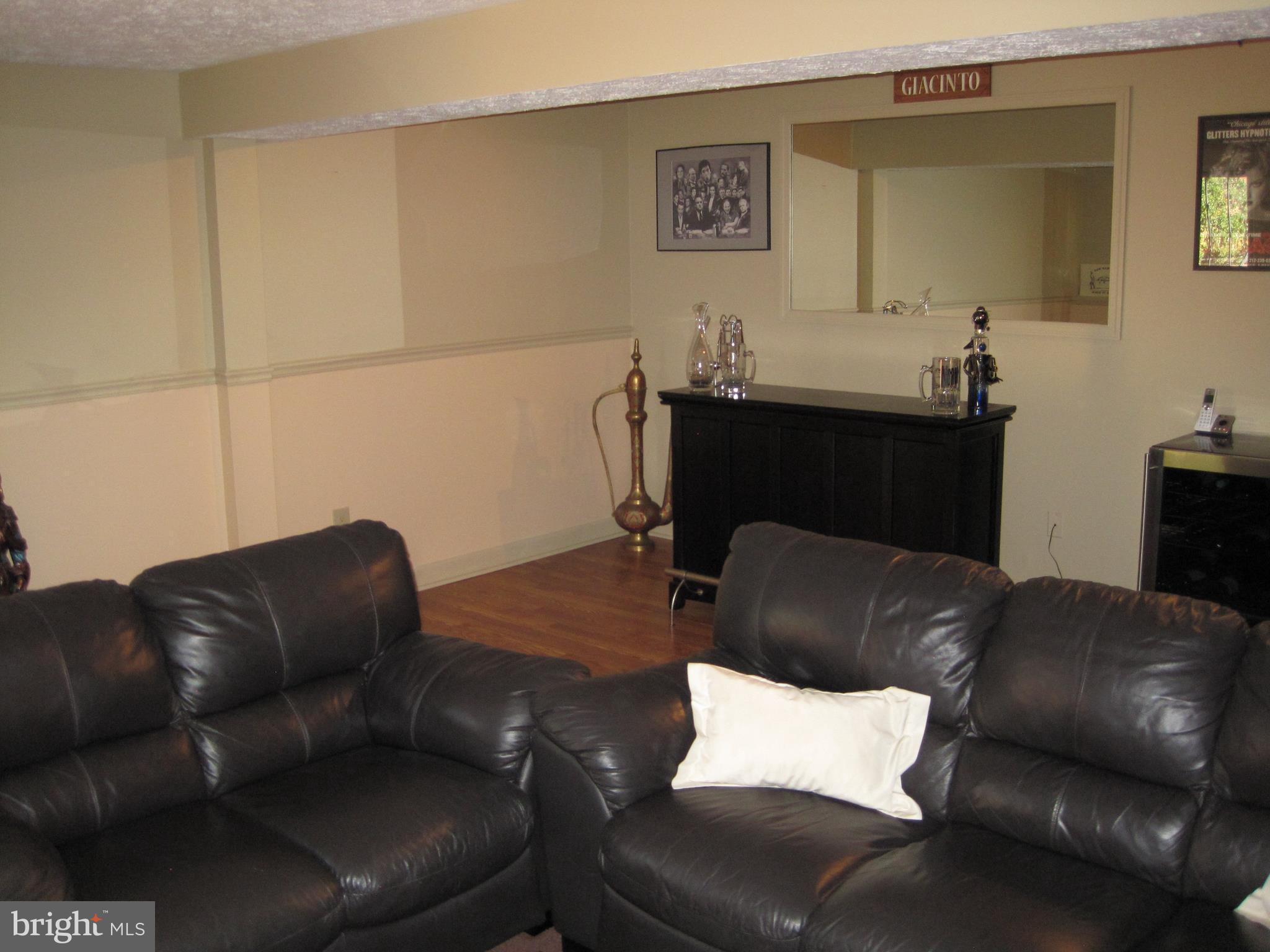 6178 Morning Glory Road Alexandria, VA 22310 - Photo 21 of 26 a living room with furniture and a air conditioner vent