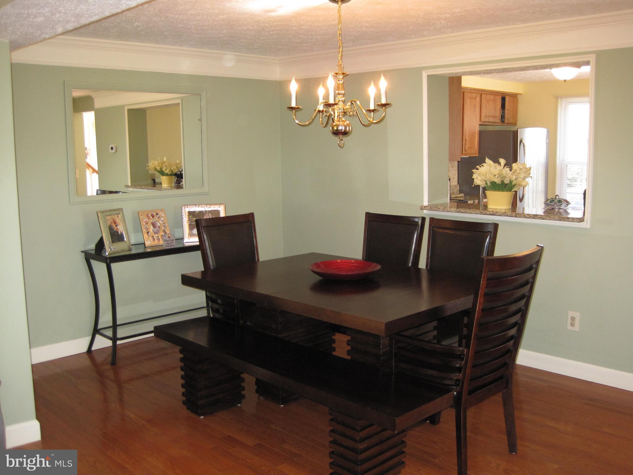6178 Morning Glory Road Alexandria, VA 22310 - Photo 8 of 26 a view of a dining room with furniture and wooden floor